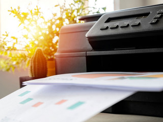 The printer is fully functional,Located on the desk.