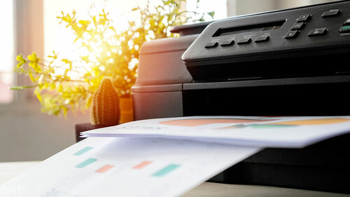 The printer is fully functional,Located on the desk.