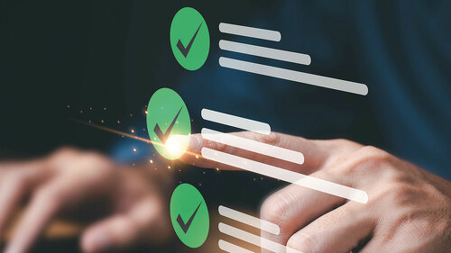 Business performance checklist, businessman using laptop doing o