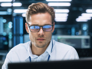 Busy Technical Customer Support Specialist is Talking on Headset