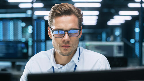 Busy Technical Customer Support Specialist is Talking on Headset