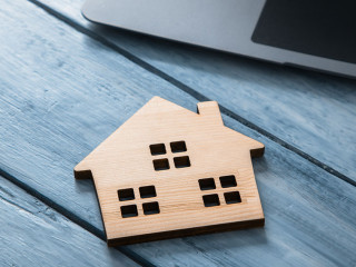 wooden house model with computer