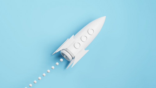 Startup and new project concept with white rocket flying up with dotted trajectory above light growth graph on blue background. 3D rendering