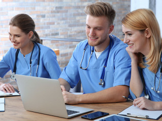Medical students in uniforms studying at university