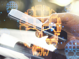 Close up of hands using tablet and smartphone with skull hologram on blurry outdoor background. Danger, hacking and digital attack concept. Double exposure.