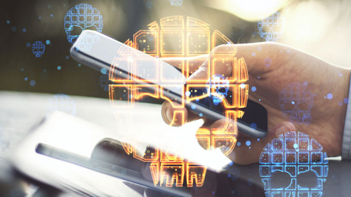 Close up of hands using tablet and smartphone with skull hologram on blurry outdoor background. Danger, hacking and digital attack concept. Double exposure.