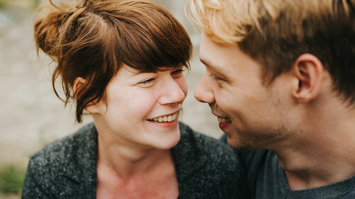 young heterosexual couple in love looking at each other