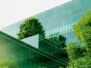 Sustainble green building. Eco-friendly building. Sustainable gl