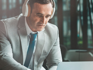 Search for information. Businessman is using laptop in the office. Copy space on the right side
