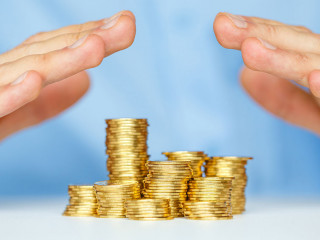 Protect new business start-up concept with hands and coin