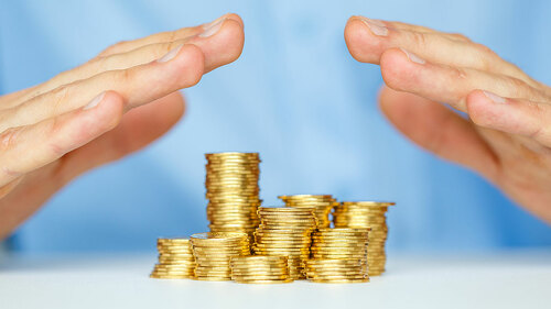 Protect new business start-up concept with hands and coin