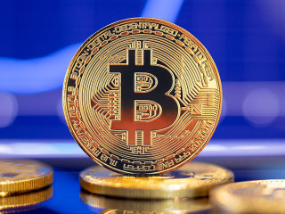 Gold Bitcoin crypto currency on background of chart diagram