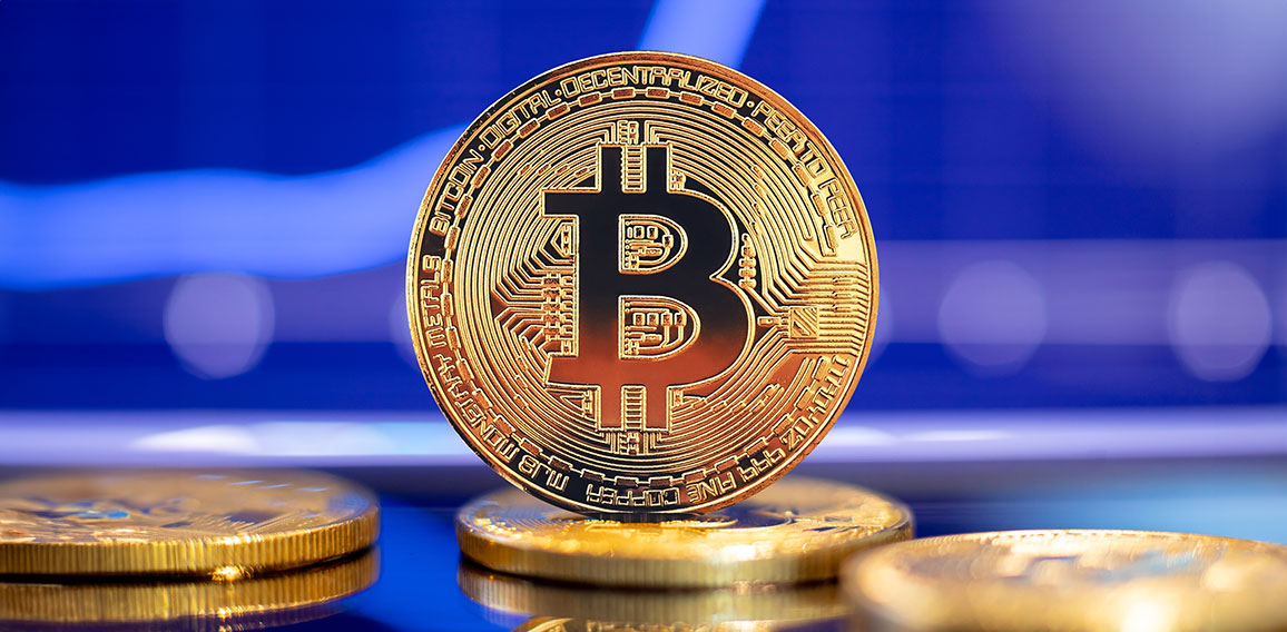 Gold Bitcoin crypto currency on background of chart diagram