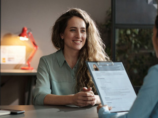 Woman presenting her resume successfully
