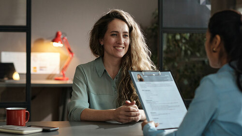 Woman presenting her resume successfully