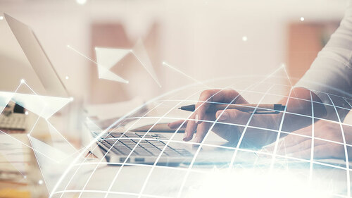 Double exposure of woman hands working on computer and world map hologram drawing. International technology business concept.
