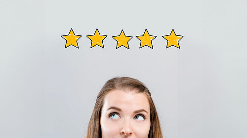 Five star rating with young woman