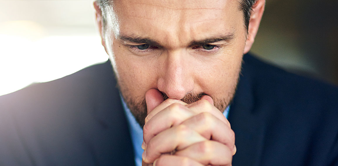 It all comes down to this. Shot of a businessman looking anxious in front of his laptop at work.