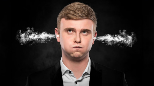 Stressful man with smoke coming out from his ears.