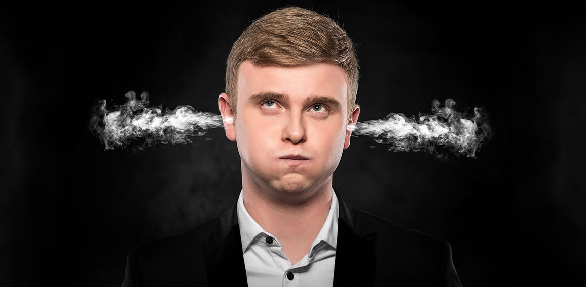Stressful man with smoke coming out from his ears.