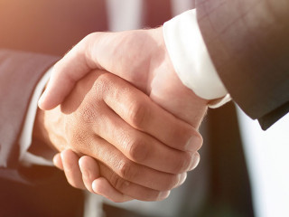 Business men giving a handshake. Business concept
