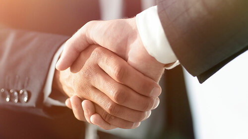 Business men giving a handshake. Business concept