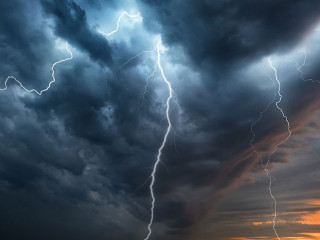 Lightning thunderstorm flash over the night sky. Concept on topi