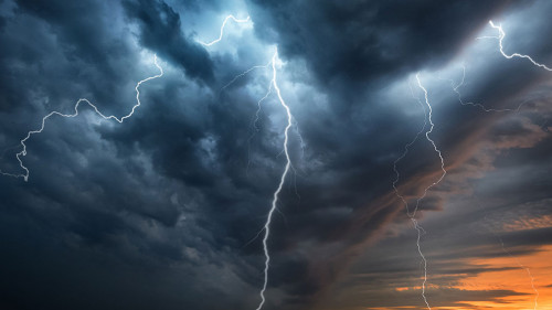 Lightning thunderstorm flash over the night sky. Concept on topi