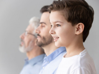 Child boy grandson stand in row with father and grandfather