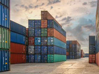 perspective view of containers at containers yard with forklift