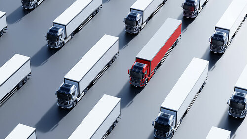 Fleet of new heavy trucks with one selected. Transportation