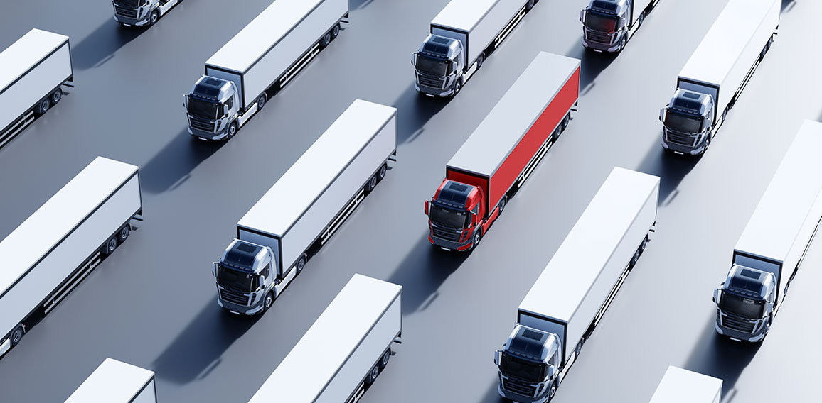 Fleet of new heavy trucks with one selected. Transportation