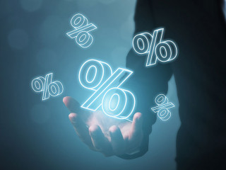 Interest rate financial and mortgage rates concept. Businessman hand show icon percent 3d sign