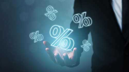 Interest rate financial and mortgage rates concept. Businessman hand show icon percent 3d sign