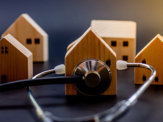 Mini wooden house with Stethoscope using as check up business fi