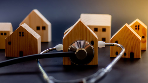 Mini wooden house with Stethoscope using as check up business fi
