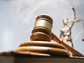 Statue of lady justice on bright background - Side view with cop