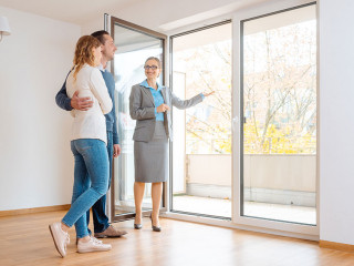 Young couple getting tour through apartment they consider renting