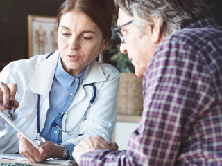 Doctor with patient in medical office