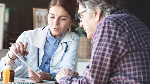 Doctor with patient in medical office