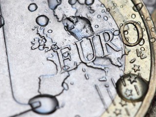 euro coin detail with water drops