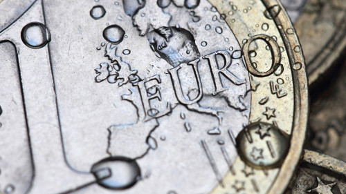 euro coin detail with water drops