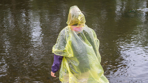 Woman with Rain Coat in the Rain