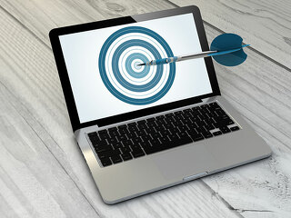 target laptop over wooden tablet