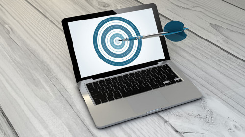 target laptop over wooden tablet