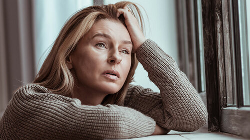Woman thinking about suicide after personal problems