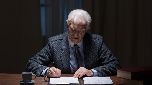 Man filling the documents