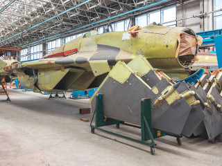 Aviation factory of military aircraft. Assembly of the Russian fighter. Focus on the cockpit