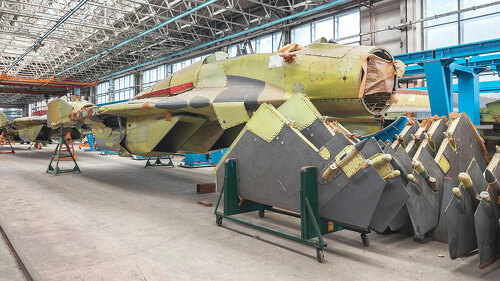 Aviation factory of military aircraft. Assembly of the Russian fighter. Focus on the cockpit
