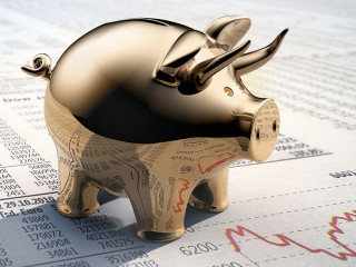 Goldenes Sparschwein auf Börsenkursen